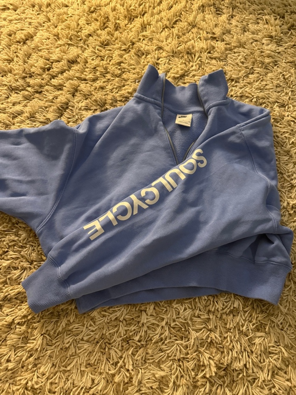 soulcycle pastel blue quarter-zip pullover with sleeve logo